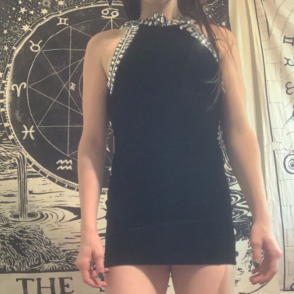 little black dress with a bedazzled neckline